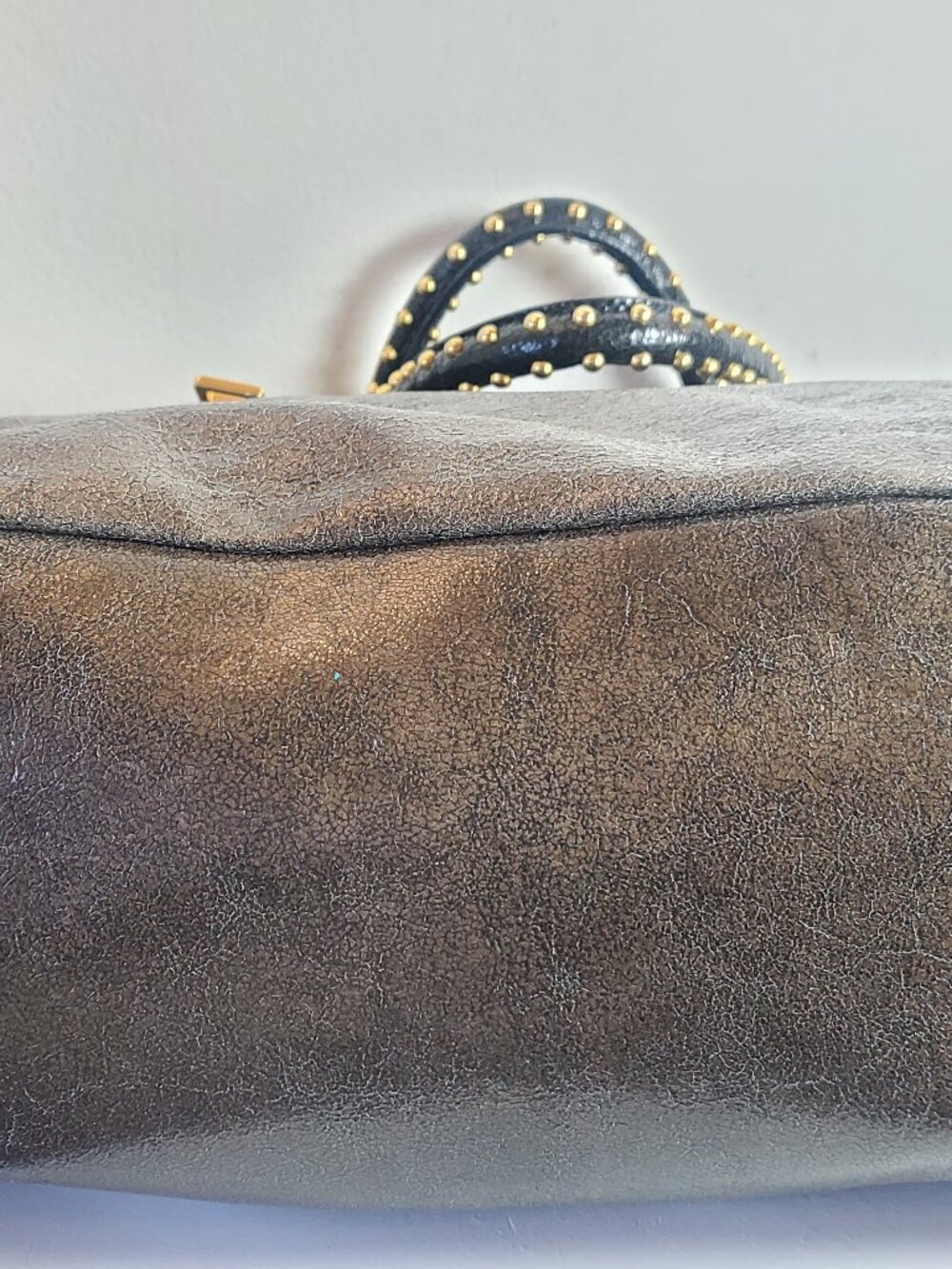34. Prada Metalic grey studded zip top satchel top handle bag